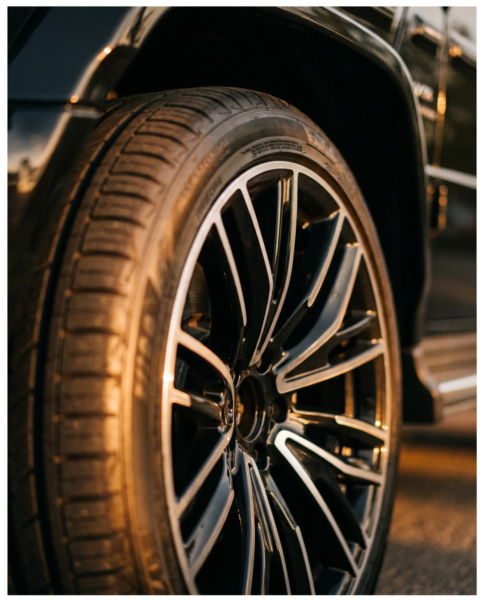 Alloy wheel detail of a DFG fleet SUV at golden hour
